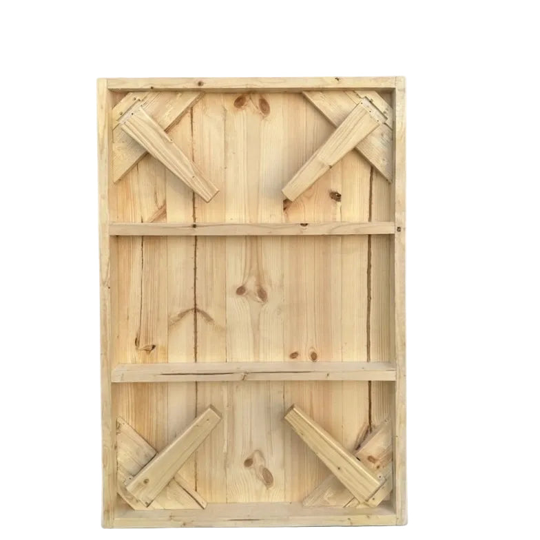A rectangular unfinished wooden crate or storage box made of light natural wood planks with corner braces, shown on a plain white background.